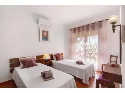a room with two beds and a window at Holiday Home Casa Mila - Sunny Way by Interhome in Albufeira