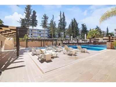 a patio with lounge chairs and a swimming pool at Apartment Ivone - Sunny Way by Interhome in Albufeira