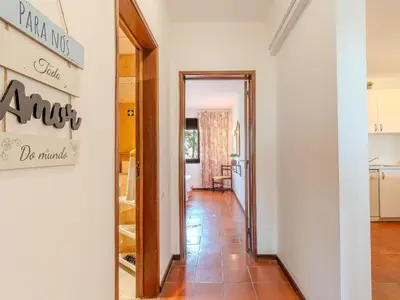 a dining room and kitchen with a glass table and chairs at Apartment Lima - Sunny Way by Interhome in Albufeira