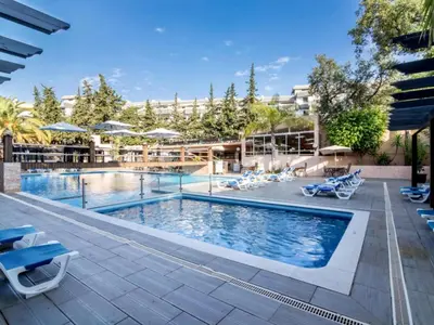 a patio with lounge chairs and a swimming pool at Apartment Lima - Sunny Way by Interhome in Albufeira