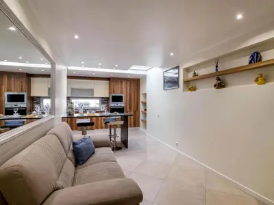 a living room with a couch and a kitchen at Apartment Malick - Sunny Way by Interhome in Albufeira