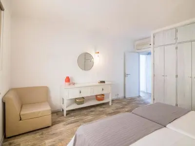a living room with a couch and a television at Apartment Patrick - Sunny Way by Interhome in Albufeira