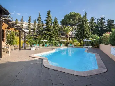 a swimming pool in the middle of a courtyard at Apartment Patrick - Sunny Way by Interhome in Albufeira