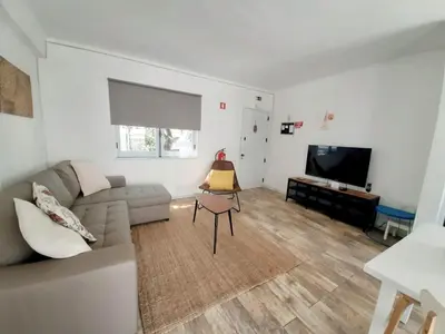 a living room with a couch and a table at Apartment Patrick - Sunny Way by Interhome in Albufeira