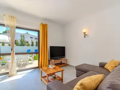 a white kitchen with a sink and a dishwasher at Villa Amélia - Sunny Way by Interhome in Albufeira