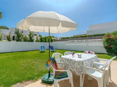 a bedroom with two beds and a table with a lamp at Villa Amélia - Sunny Way by Interhome in Albufeira