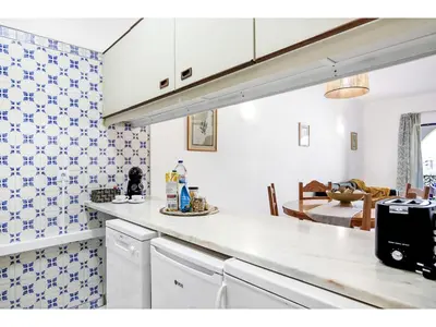 a kitchen with blue and white tiles on the wall at Apartment Anamar - Sunny Way by Interhome in Albufeira