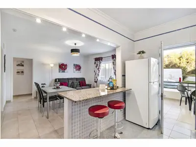 a kitchen and living room with a white refrigerator at Apartment Manelito House - Sunny Way by Interhome in Albufeira