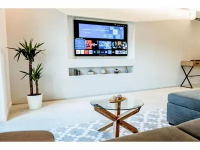 a living room with a tv on a wall at Apartment Sunlight Albufeira - Sunny Way by Interhome in Albufeira