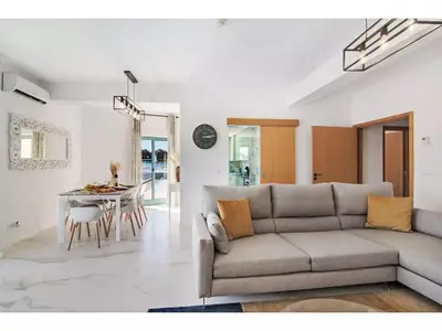 a living room with a couch and a table at Apartment W Marina - Sunny Way by Interhome in Albufeira