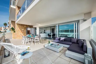 a living room with a purple couch and chairs at Lovely Modern Apartment With Pool in Albufeira