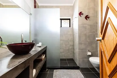 a bathroom with a sink and a toilet at Ground floor with direct access to swimming pool in Albufeira