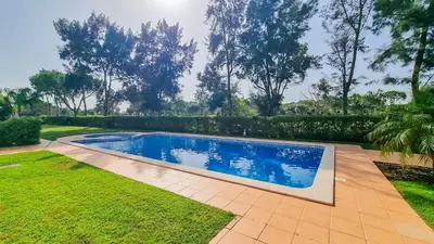 an image of a swimming pool in a yard at Golfview Apartment in Quarteira