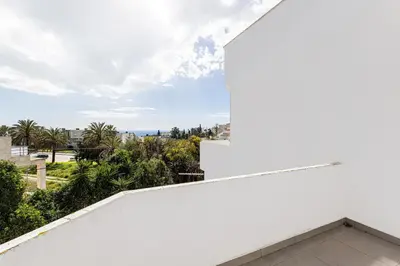 a white house with a view of the ocean at Quiet & Sea in Albufeira