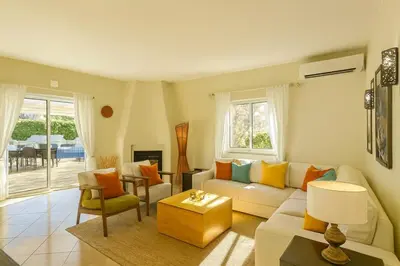 a living room with a couch and a table at Villa Mar by Sunny Deluxe in Albufeira