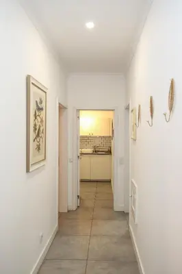 an empty room with a hallway with a mirror at Casa Tomás in Faro