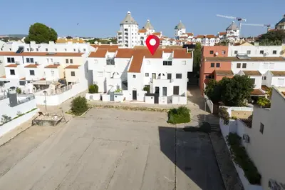 an aerial view of a city with a red marker at Ancora Mar - Vilamoura Marina by HD in Vilamoura