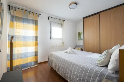 a bedroom with a large bed and a window at Ancora Mar - Vilamoura Marina by HD in Vilamoura