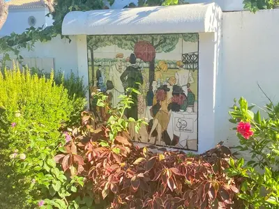 a mosaic mural on the side of a building at Solar Vilamoura Relaxing Apartment Stay in Quarteira