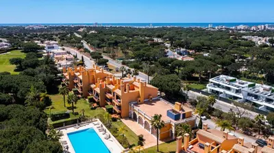 an aerial view of a resort with a swimming pool at F5 Vila Sol Q Pool & Golf in Vilamoura in Quarteira