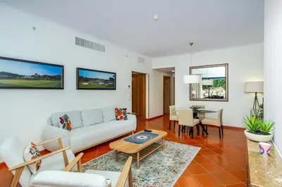a living room with a couch and a table at F5 Vila Sol AP Pool & Golf in Vilamoura in Quarteira