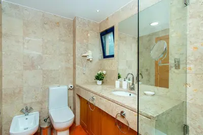 a bathroom with a toilet and a shower and a sink at F5 Vila Sol AP Pool & Golf in Vilamoura in Quarteira