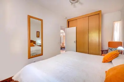 a dining room with a table and chairs and a chandelier at Villa Mario - Swimming pool - WIFI - BY BEDZY in Albufeira