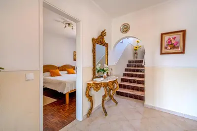 a hallway with plants and a white door at Villa Mario - Swimming pool - WIFI - BY BEDZY in Albufeira