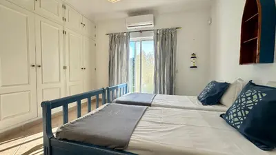 a bedroom with two beds and a window at Pinheiro Manso by Check-in Portugal in Albufeira