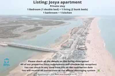 an aerial view of a beach with a bridge at Blife Josya private apartment at Faro beach in Faro