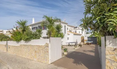 a white house with a fence and trees at Villa Francisco by Villa Select in Galé