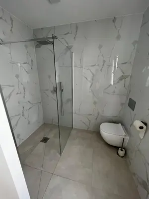 a bathroom with a shower and a toilet in it at Casa Alegria in Tunes