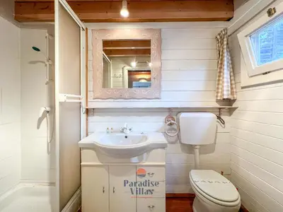 a small bathroom with a sink and a toilet at 7 Bedrooms, Main House, Bungalow, Private Pool in Fonte da Murta