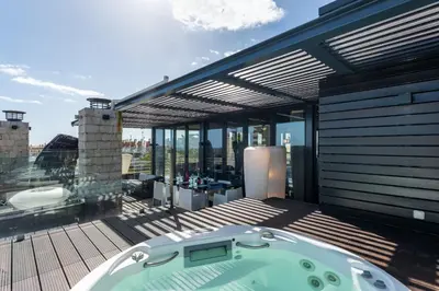 a jacuzzi tub on top of a building at Penthouse Grand Noir in Guia
