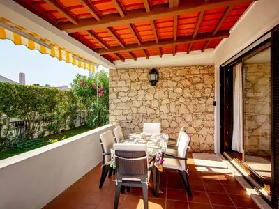 a patio with a table and chairs on a balcony at Holiday Home Lotus Villa 2- Albufeira by Interhome in Albufeira