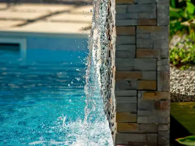 a water fountain in a swimming pool at Holiday Home Lotus Villa 2- Albufeira by Interhome in Albufeira