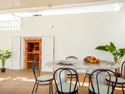 a dining room with a table and chairs at Holiday Home Chalet Villa Brigida mit privatem Pool by Interhome in Albufeira