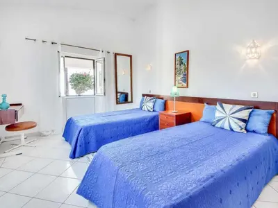 a bedroom with two beds and a window at Holiday Home Chalet Villa Brigida mit privatem Pool by Interhome in Albufeira