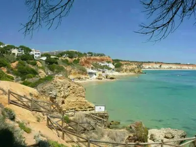 a view of a beach with houses and the ocean at Apartment mit Terrasse by Interhome in Albufeira