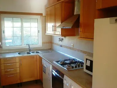 a kitchen with a sink and a stove top oven at Apartment mit Balkon by Interhome in Albufeira