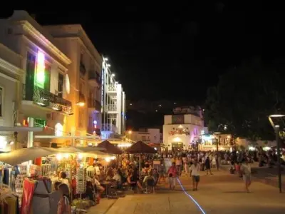 a crowd of people walking around a street at night at Apartment Wohnung mit Terrasse by Interhome in Albufeira