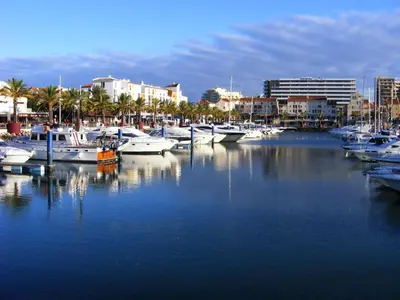 a group of boats docked in a marina with buildings at Apartment Wohnung mit Balkon by Interhome in Albufeira