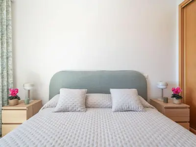 a bedroom with a bed with two pillows on it at Apartment Elena 2 mit Blick auf das Wasser by Interhome in Albufeira