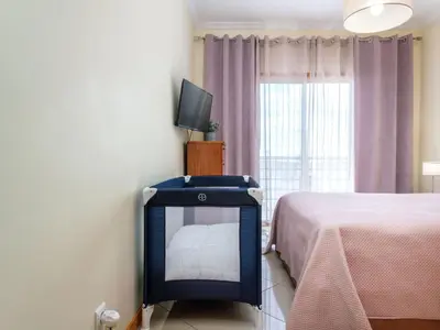a bedroom with a bed and a tv in a room at Apartment Elena 1 mit Blick auf das Wasser by Interhome in Albufeira