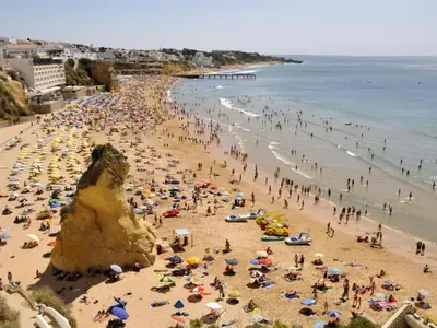 a large crowd of people on a crowded beach at Apartment mit Terrasse by Interhome in Albufeira