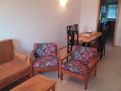 a dining room with a table and chairs and a table and a table and chairs at Apartment mit Terrasse by Interhome in Albufeira