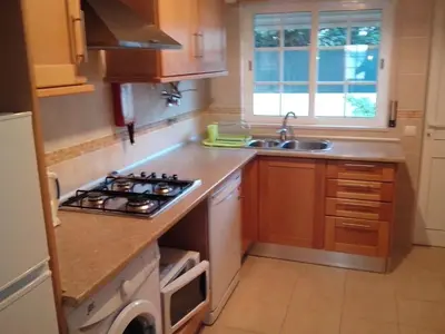 a kitchen with a stove top oven next to a sink at Apartment mit Terrasse by Interhome in Albufeira