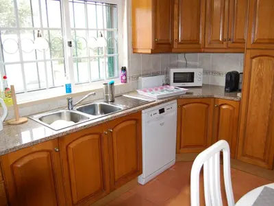 a kitchen with a sink and a microwave at Holiday Home Villa Monte Alegrete by Interhome in Loulé