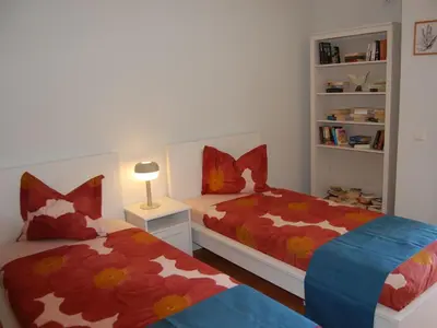 a bedroom with two beds and a book shelf at Holiday Home Villa Monte Alegrete by Interhome in Loulé