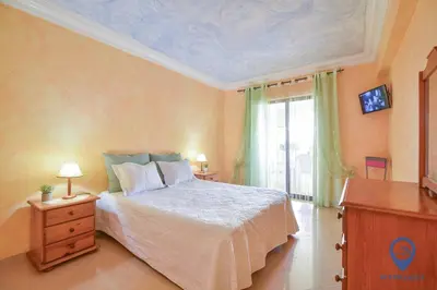 a bedroom with a bed and a window at Vitoria 1 by MTPhomes in Albufeira